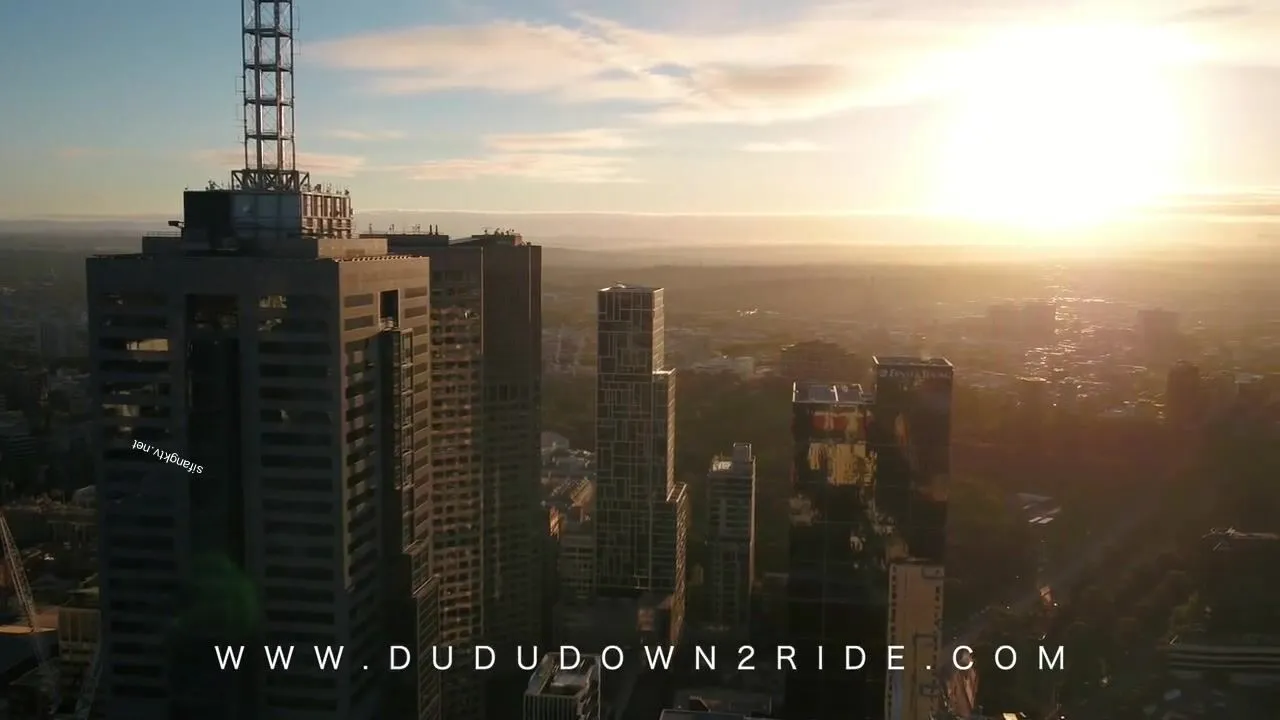 A woman stands confidently her body language exuding self-assurance and allure a powerful presence in a dynamic setting